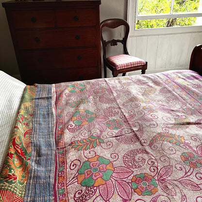 Handcrafted Vintage Kantha Quilt – Fluid Leaf & Paisley Twirls lifestyle shot showing cascading leaves and foliage in orange, green, yellow and pink