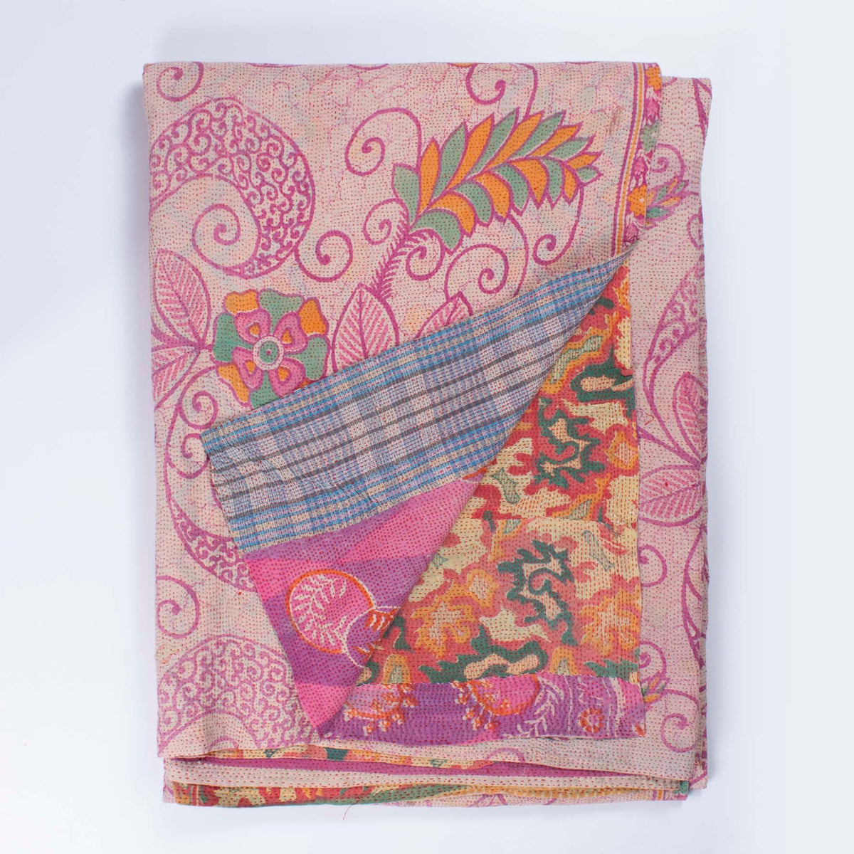 Handcrafted Vintage Kantha Quilt – Fluid Leaf & Paisley Twirls folded, showing both reversible sides – fluid leaf side and dynamic paisley twirl reverse