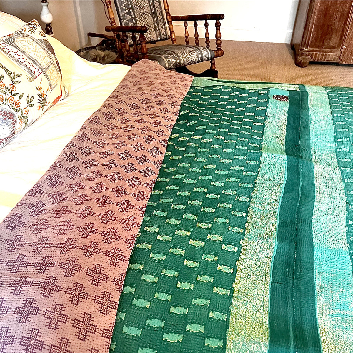Handcrafted Vintage Kantha Quilt – Purple Aqua Ocean Haze lifestyle shot showing delicate purple cross motifs scattered across fabric with adorable ditsy floral patch