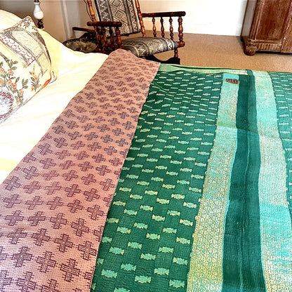 Handcrafted Vintage Kantha Quilt – Purple Aqua Ocean Haze lifestyle shot showing delicate purple cross motifs scattered across fabric with adorable ditsy floral patch