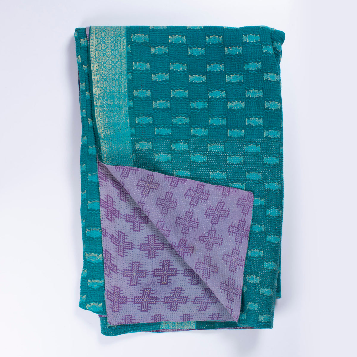 Handcrafted Vintage Kantha Quilt – Purple Aqua Ocean Haze folded, showing both reversible sides – purple cross motif side and calming aqua and ocean blue reverse