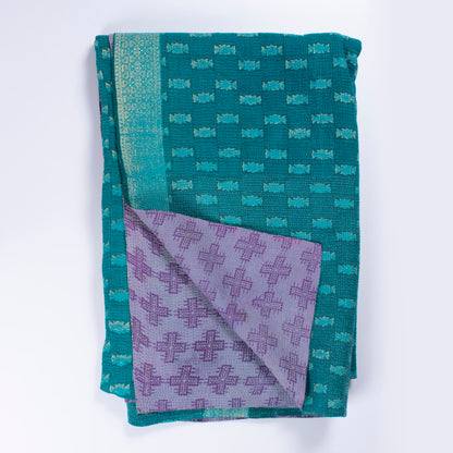 Handcrafted Vintage Kantha Quilt – Purple Aqua Ocean Haze folded, showing both reversible sides – purple cross motif side and calming aqua and ocean blue reverse