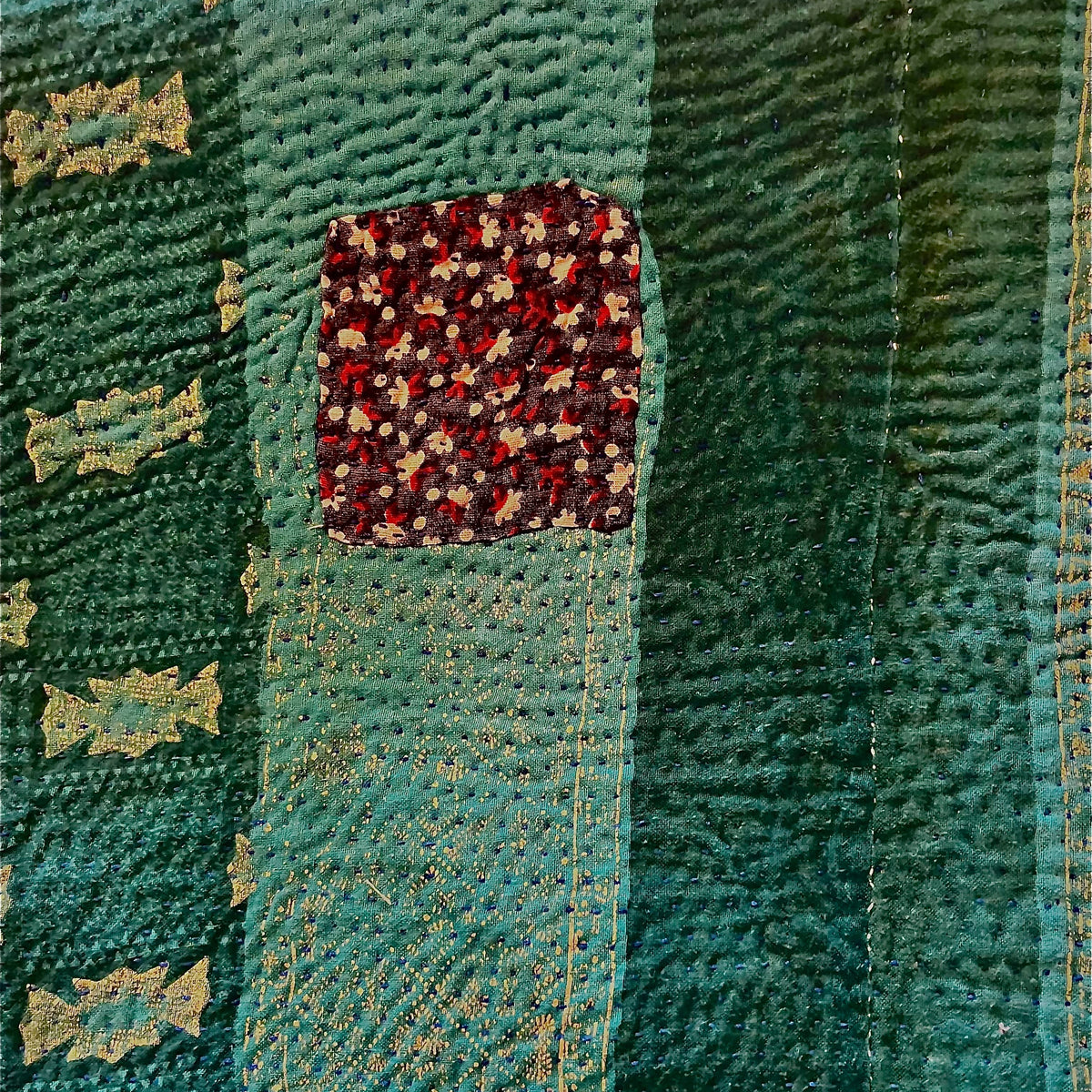 Handcrafted Vintage Kantha Quilt – Purple Aqua Ocean Haze close-up detail of the aqua teal reverse side showing intricate Kantha hand stitching texture with charming vintage floral patchwork panel and gold botanical motifs