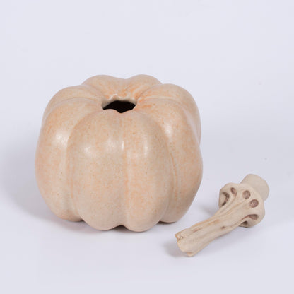 Side view of ceramic pumpkin sculpture by Gerry Unsworth, barely-there blush glaze, handmade signed studio pottery